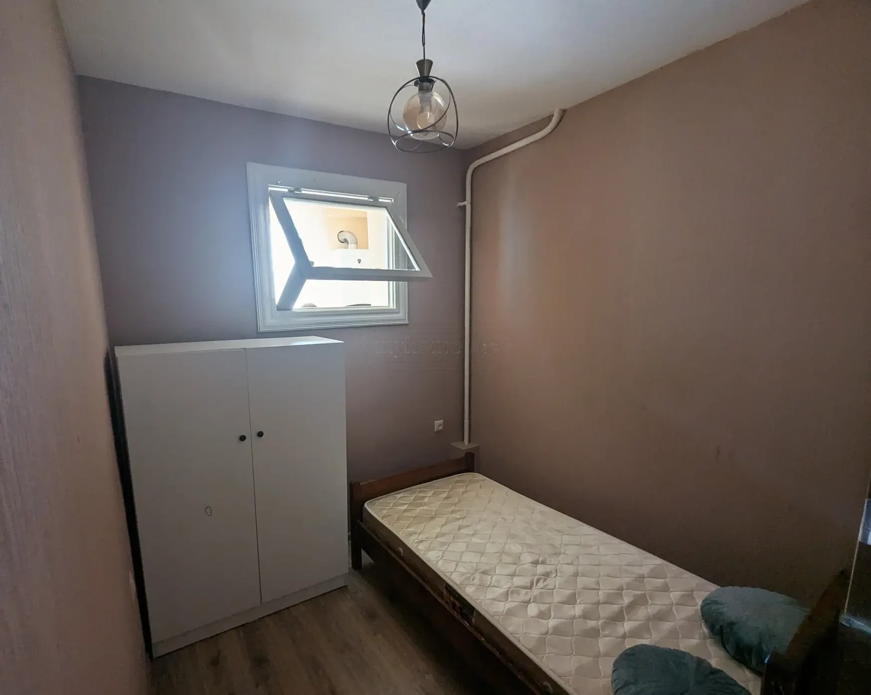 1-room apartment for rent on Marjanishvili Street, Chugureti, Tbilisi — bedroom with bed and wardrobe