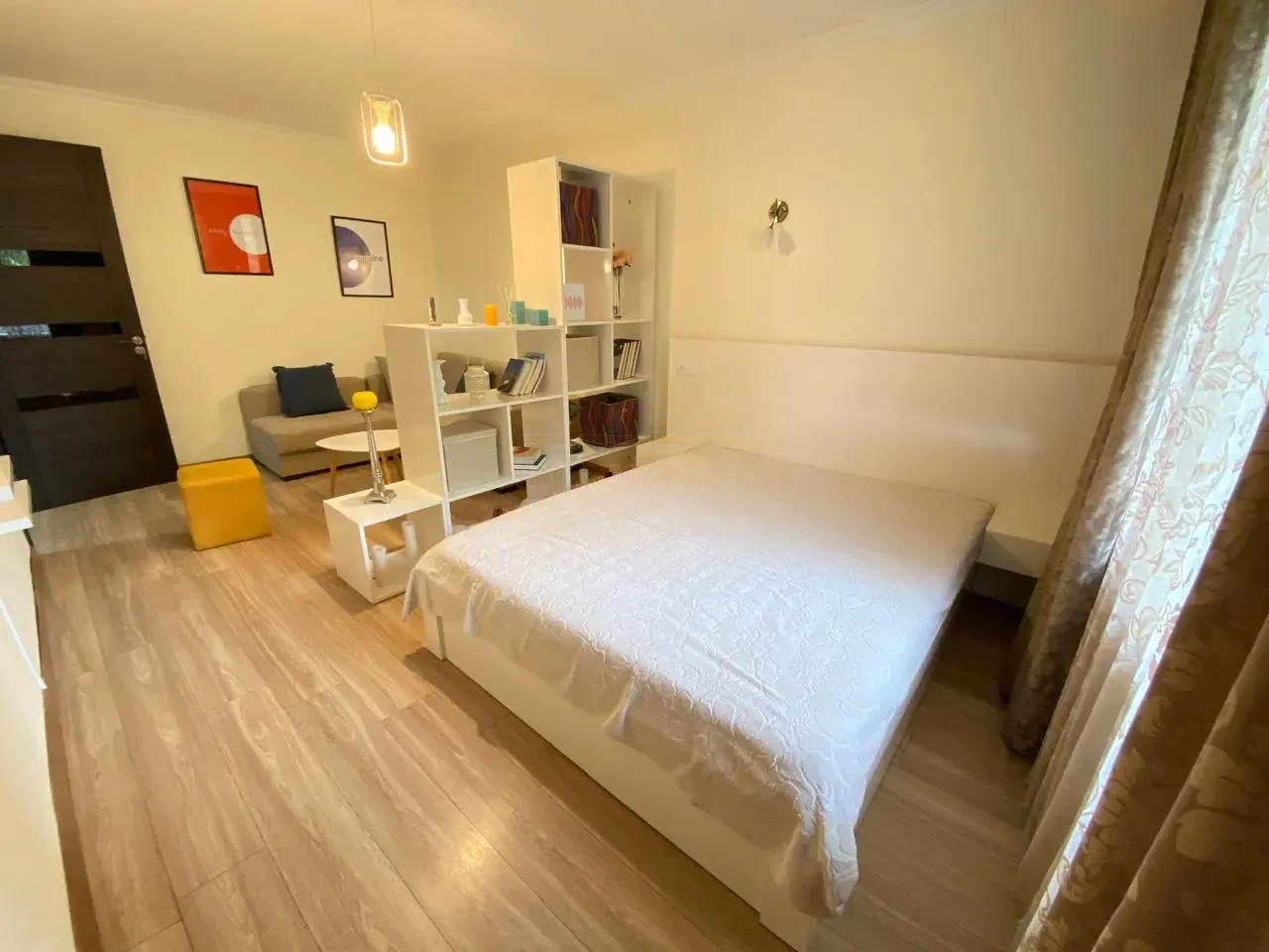 1-room apartment for rent on Vazha-Pshavela Avenue, Saburtalo, Tbilisi — double bed and living corner