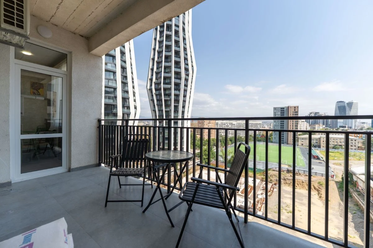 2-room apartment for rent on Chavchavadze Avenue 49b, Vake, Tbilisi — balcony with table and chairs overlooking the city