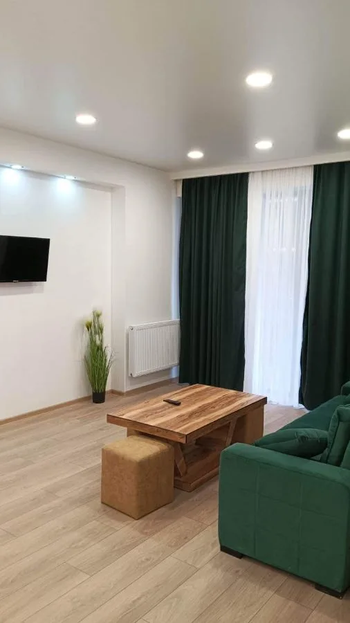 2-room apartment for rent on Chkondideli Street 101, Nadzaladevi, Tbilisi — living room with TV and balcony