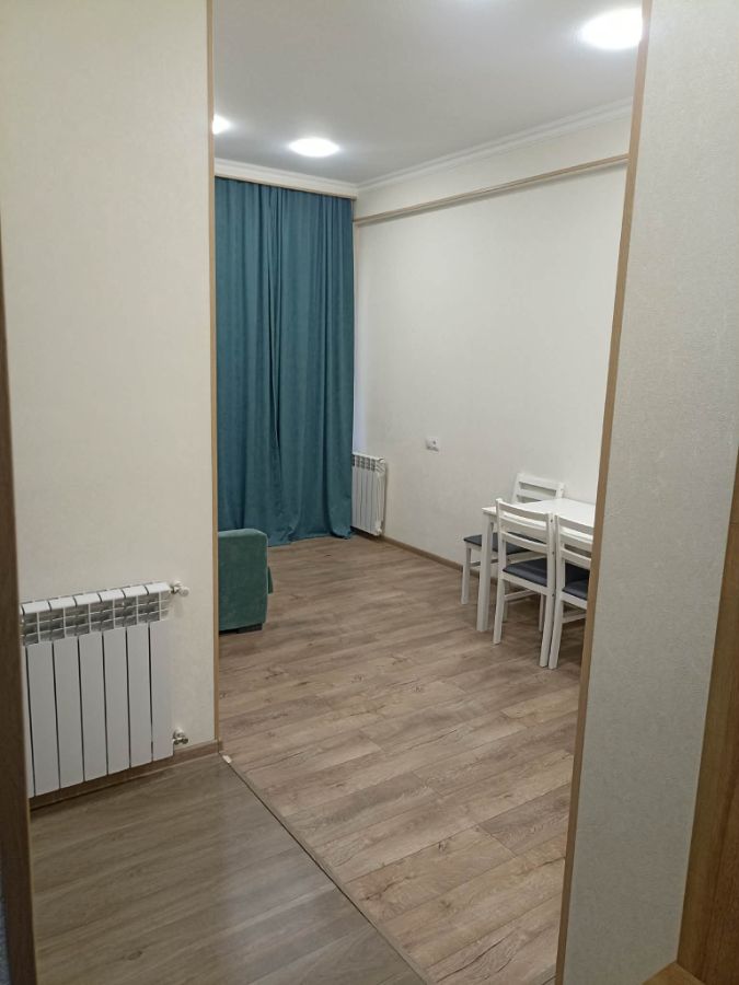 2-room apartment for rent on Chkondideli Street, Nadzaladevi, Tbilisi — living room with dining table