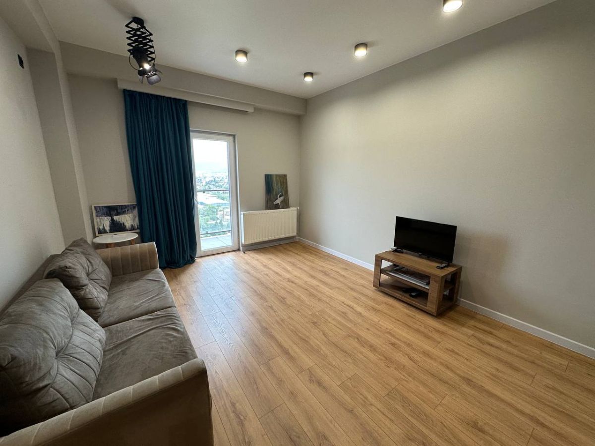 2-room apartment for rent on Chkondideli Street, Nadzaladevi, Tbilisi — living room with balcony door and city view