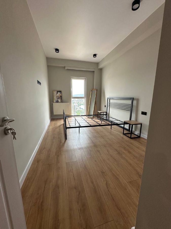 2-room apartment for rent on Chkondideli Street, Nadzaladevi, Tbilisi — bedroom with city view window