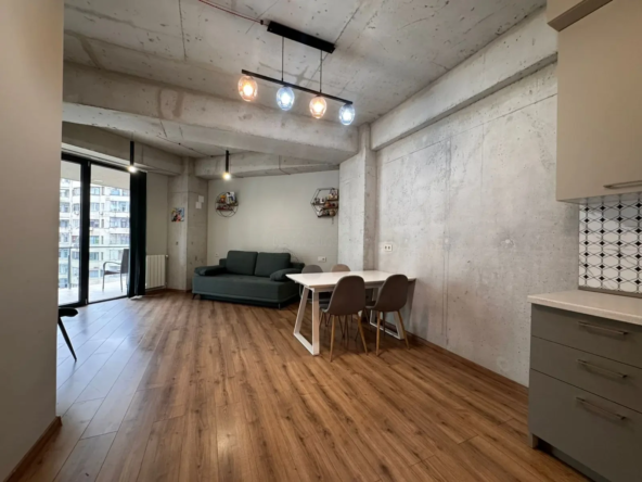 2-room apartment for sale on Avalishvili Street, Vake, Tbilisi — open-plan living room, dining area and kitchen under high loft-style ceilings