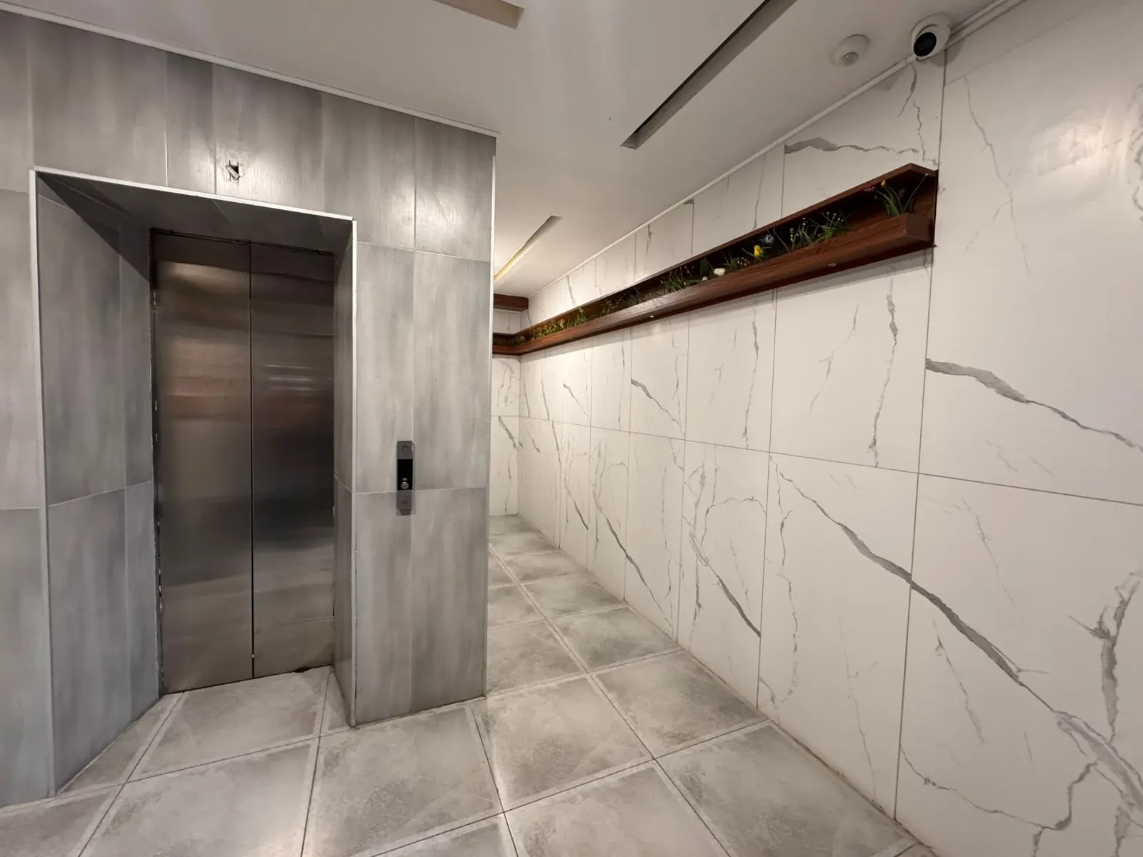 2-room apartment for sale on Avalishvili Street, Vake, Tbilisi — marble-finished lobby and lift of the Outlook Vake building