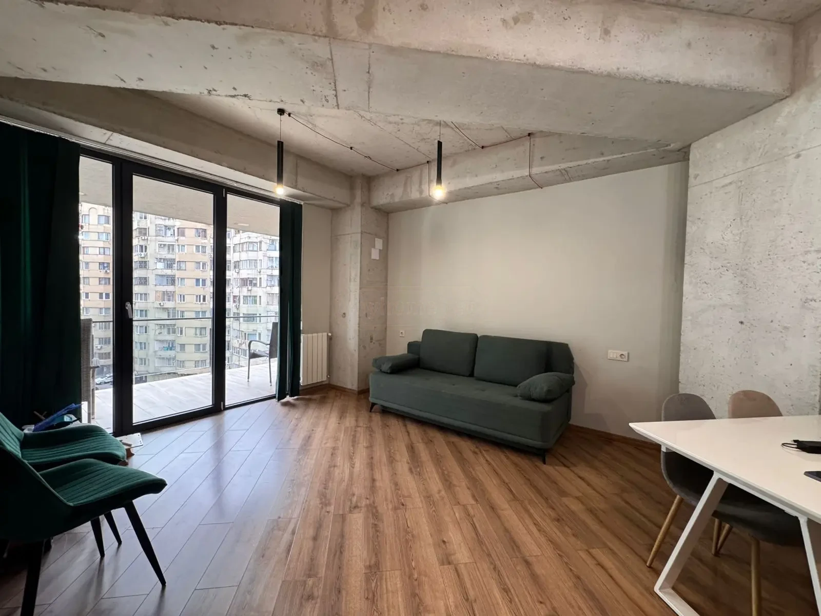 2-room apartment for sale on Avalishvili Street, Vake, Tbilisi — living room with floor-to-ceiling doors onto the balcony