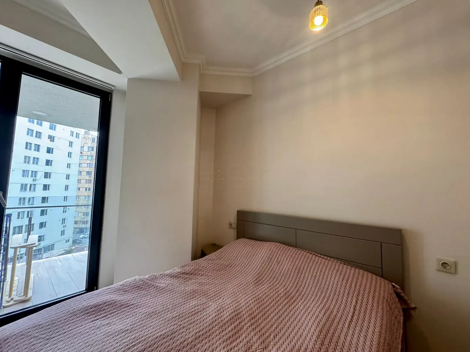 2-room apartment for sale on Avalishvili Street, Vake, Tbilisi — bedroom with balcony access and city outlook