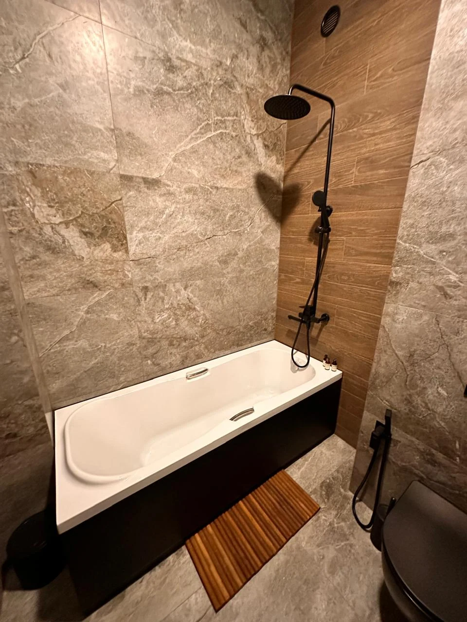2-room apartment for sale on Chavchavadze Avenue, Vake, Tbilisi — marble-tiled bathroom with bath and rainfall shower
