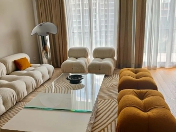 2-room apartment for sale on Ilia Chavchavadze Avenue, Vake, Tbilisi - open-plan living room with designer sofa and balcony windows