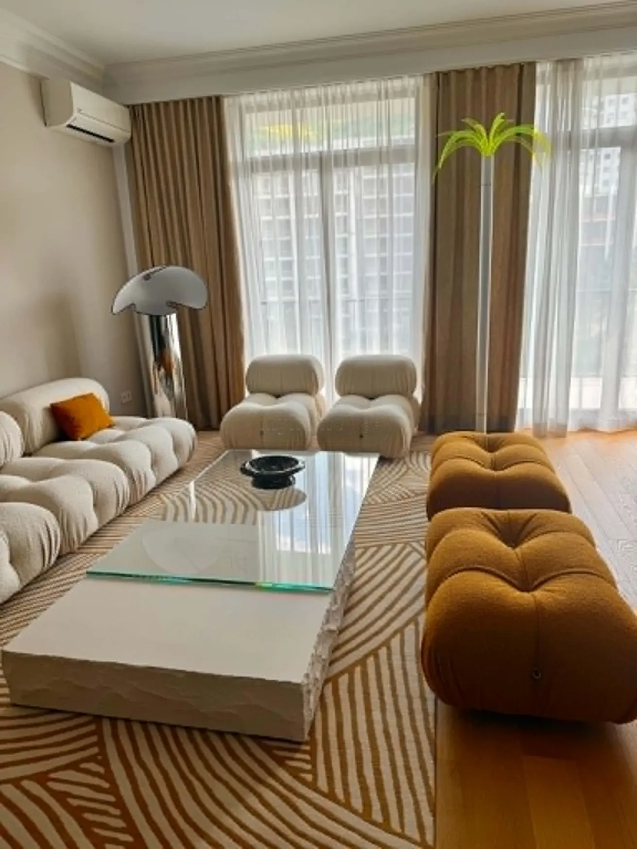 2-room apartment for sale on Ilia Chavchavadze Avenue, Vake, Tbilisi - open-plan living room with designer sofa and balcony windows
