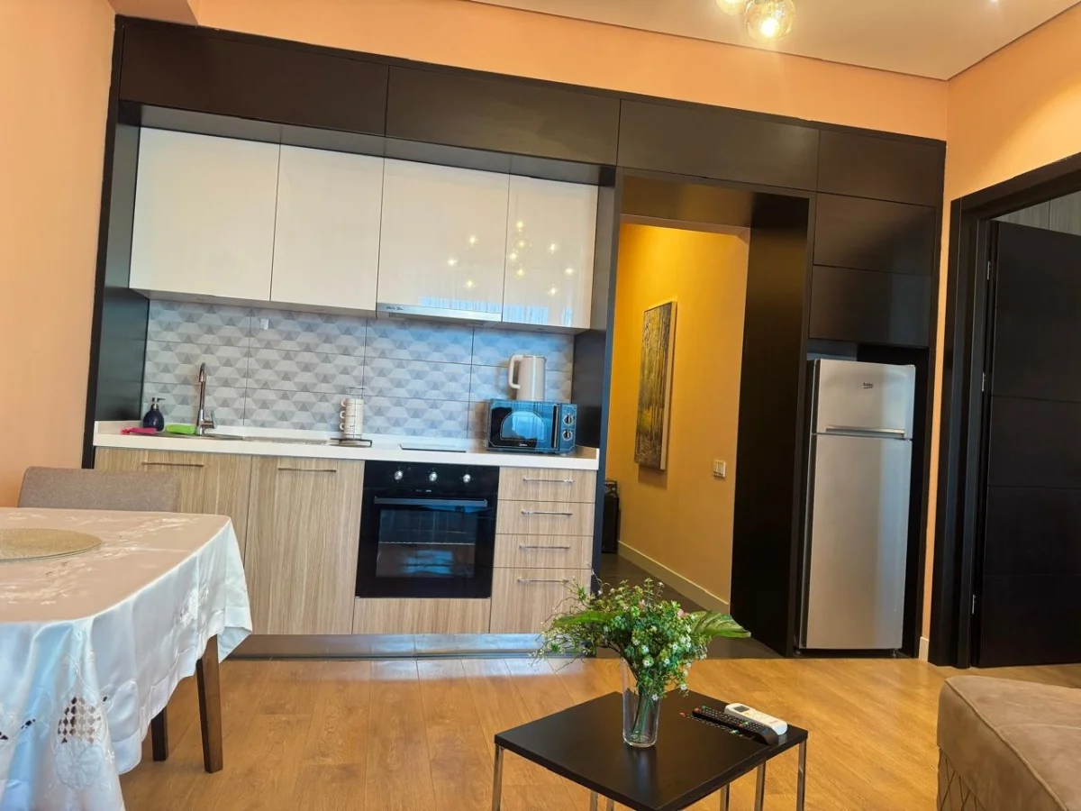 2-room apartment for sale on Chavchavadze Avenue, Vake, Tbilisi — fitted kitchen with oven, fridge and dining table