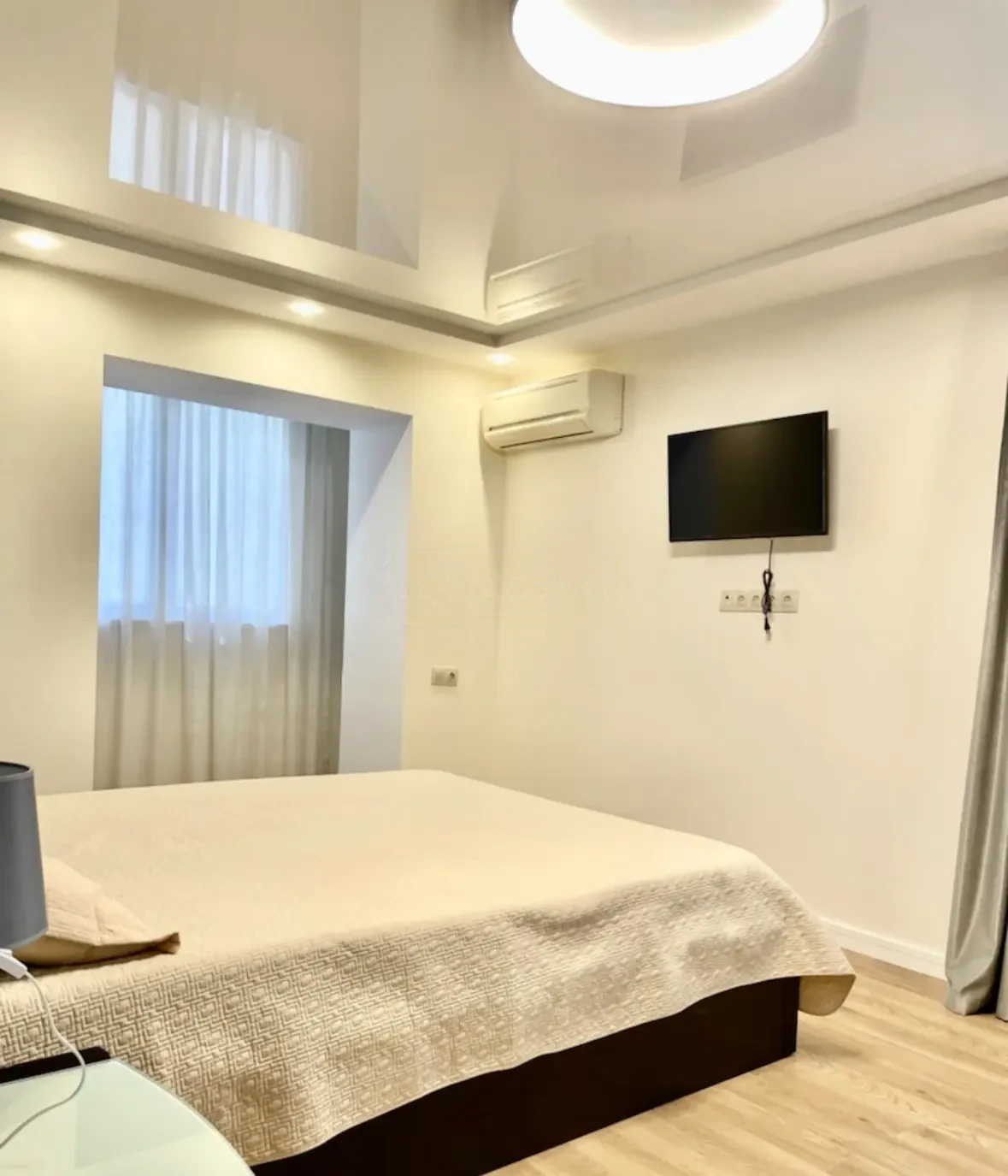 2-room apartment for sale on Irakli Abashidze Street, Vake, Tbilisi — bedroom with wall-mounted TV and air conditioning