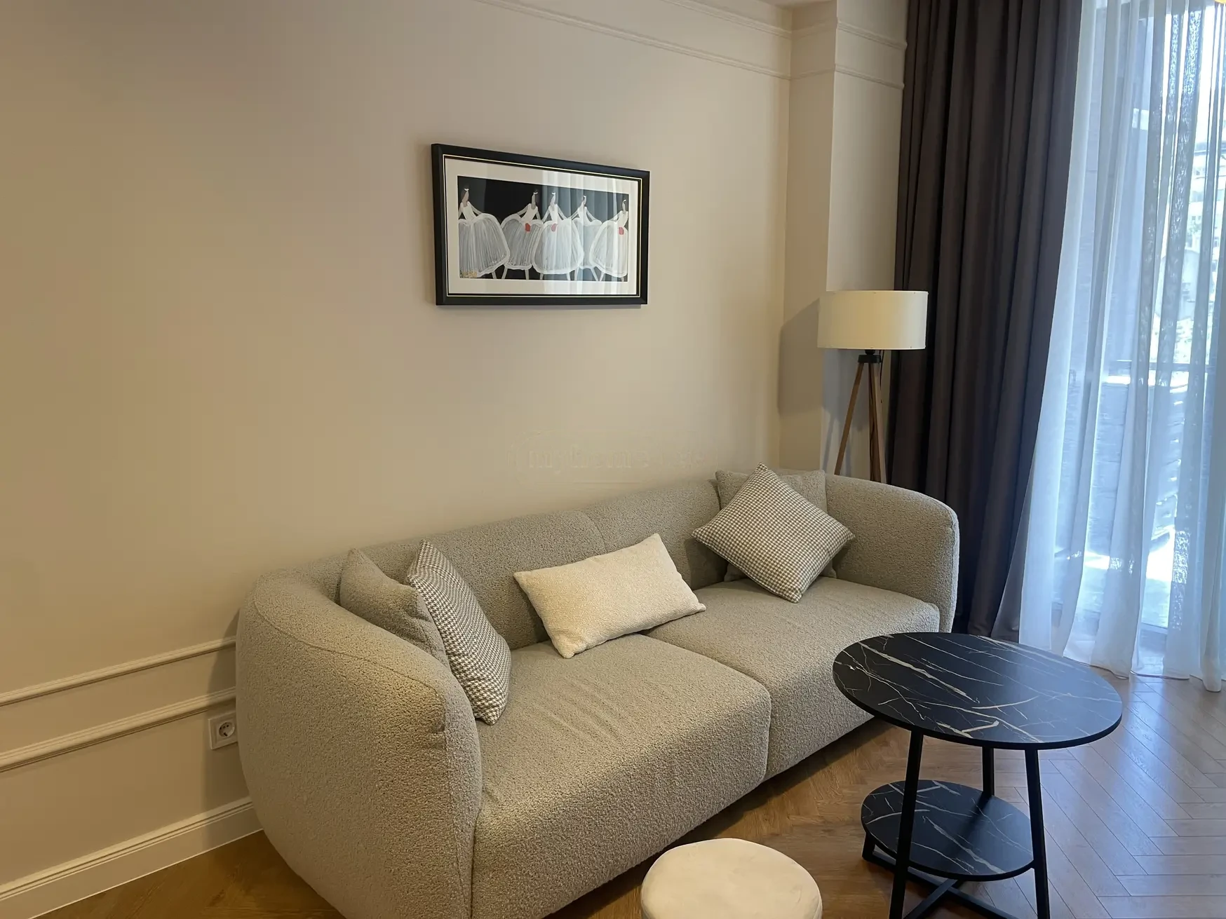 2-room apartment for sale on Kipshidze Street, Vake, Tbilisi - living room with sofa and balcony windows