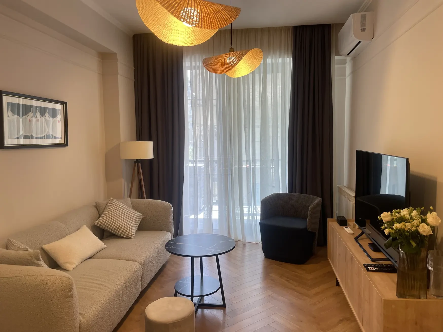 2-room apartment for sale on Kipshidze Street, Vake, Tbilisi - living room with TV unit and balcony access