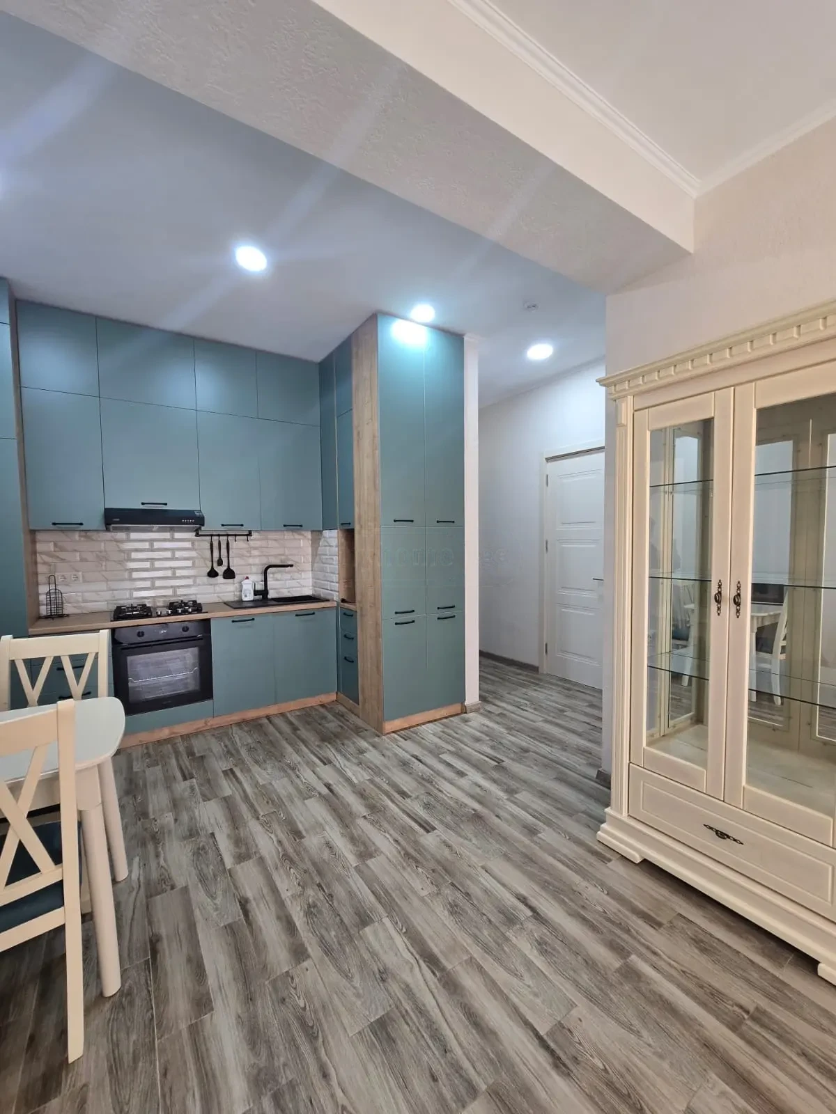 2-room furnished apartment for sale on Mindeli Street 9b, Saburtalo, Tbilisi — teal kitchen with full appliances