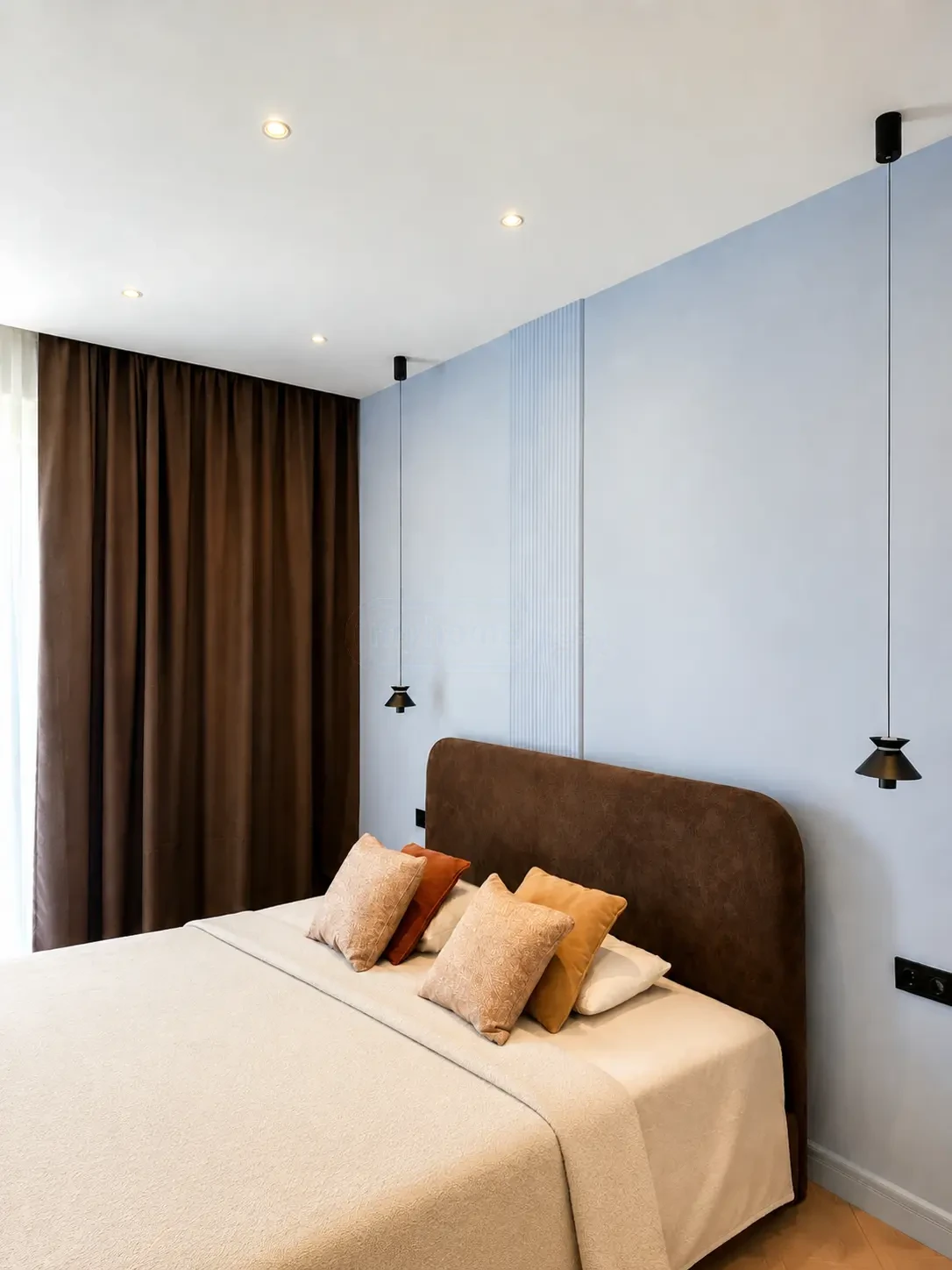 2-room furnished apartment for sale on Nutsubidze Street 125, top floor, Saburtalo, Tbilisi — bedroom with pendant lights and brown accent curtains
