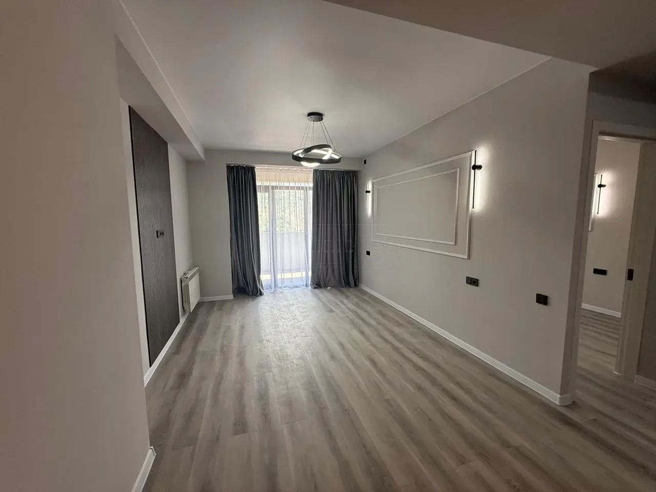 2-room apartment for sale on Politkovskaya Street, Saburtalo, Tbilisi — living room opening to the hallway and bedroom