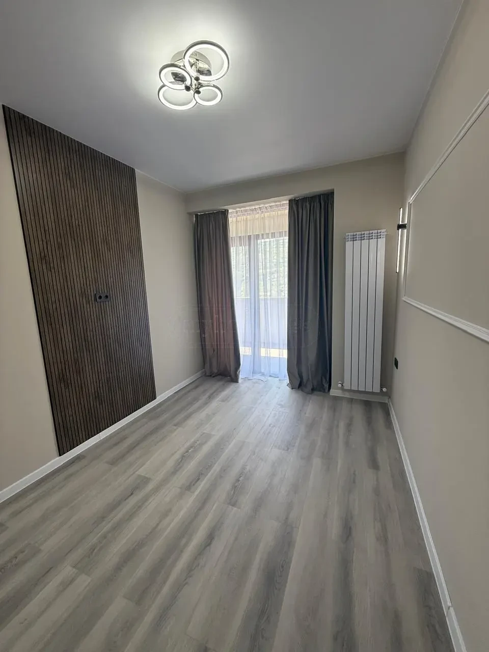2-room apartment for sale on Politkovskaya Street, Saburtalo, Tbilisi — bedroom with wood-slat feature wall