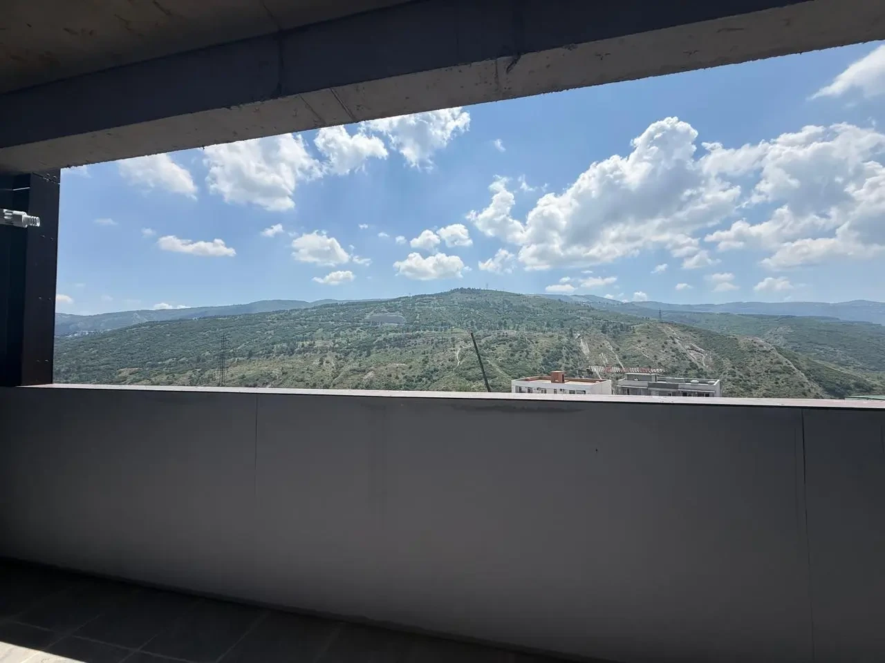 2-room apartment for sale on Politkovskaya Street, Saburtalo, Tbilisi — panoramic view of the hills from the balcony