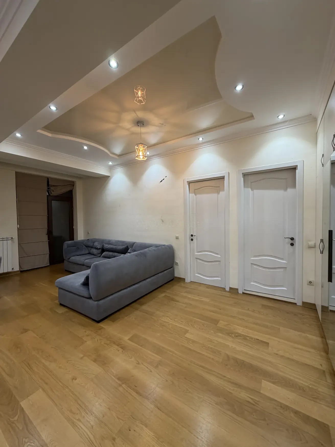 2-room apartment for sale on Shatberashvili Street, Vake, Tbilisi — living room with corner sofa