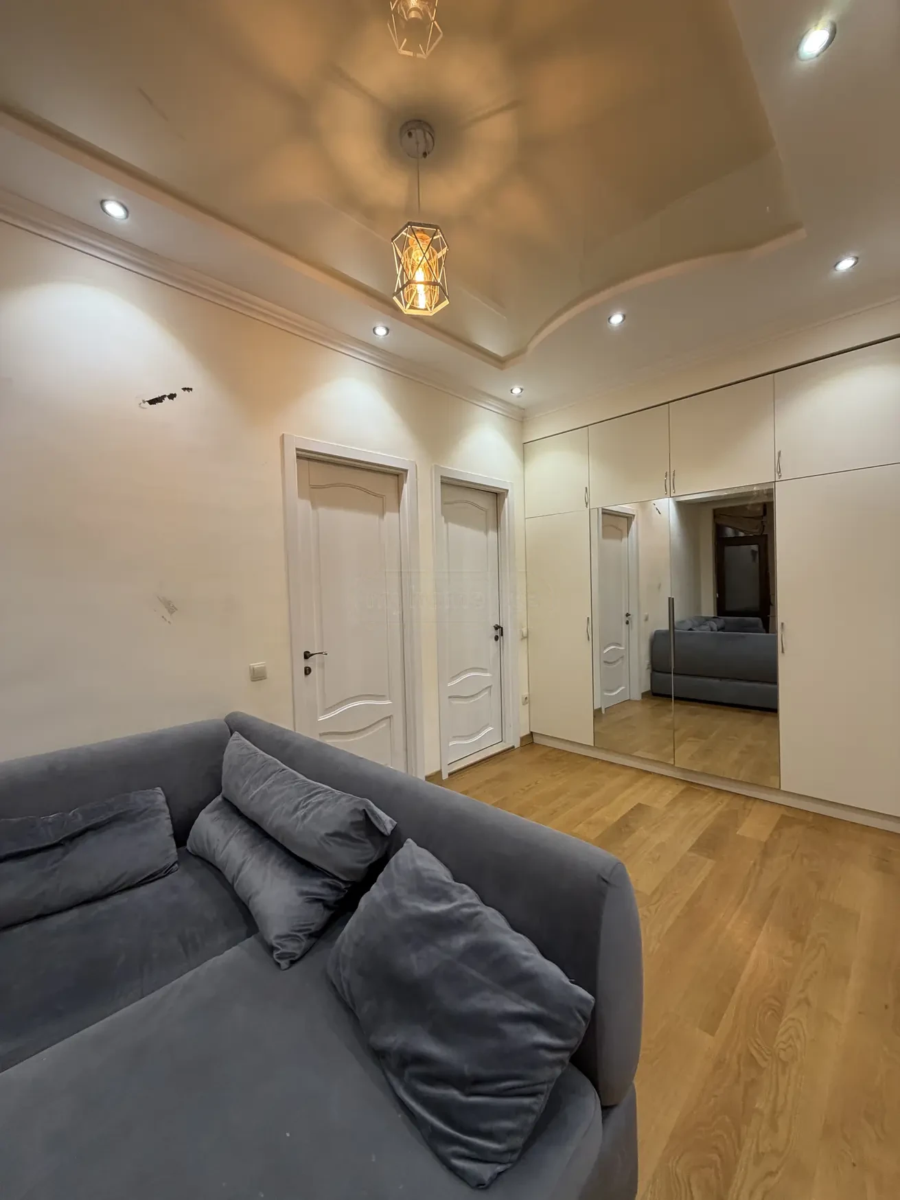 2-room apartment for sale on Shatberashvili Street, Vake, Tbilisi — living room with built-in mirrored wardrobe
