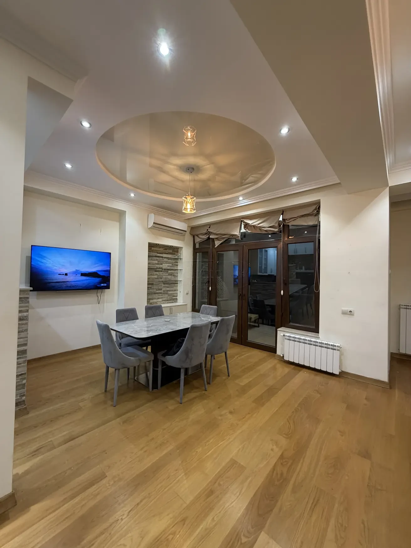 2-room apartment for sale on Shatberashvili Street, Vake, Tbilisi — dining area with marble table and balcony doors