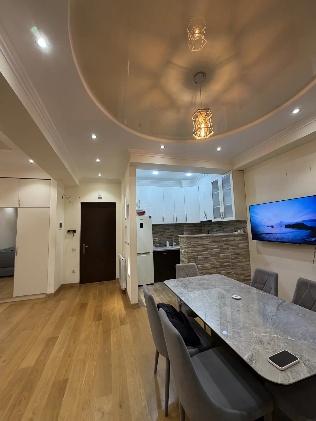 2-room apartment for sale on Shatberashvili Street, Vake, Tbilisi — entrance hall and open kitchen seen from the dining area