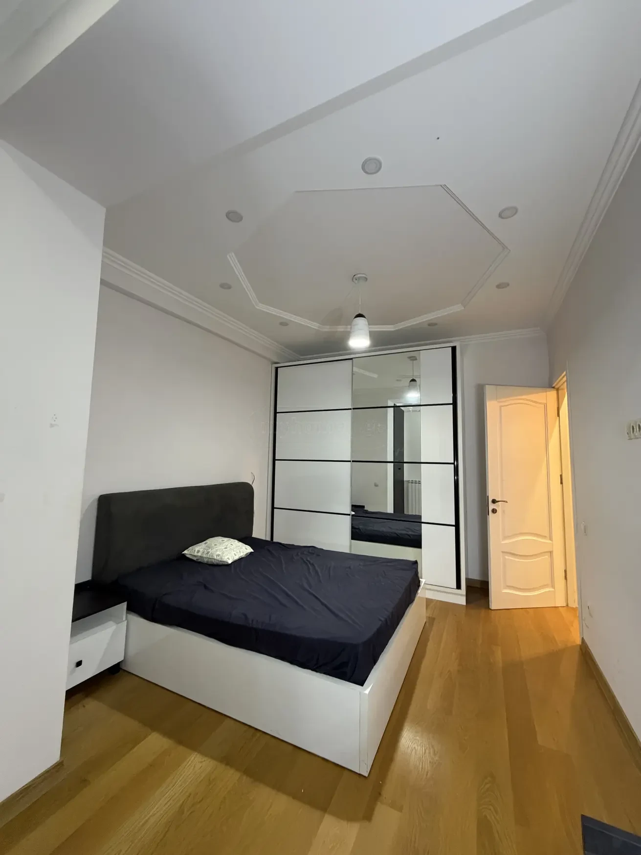 2-room apartment for sale on Shatberashvili Street, Vake, Tbilisi — second bedroom with mirrored wardrobe
