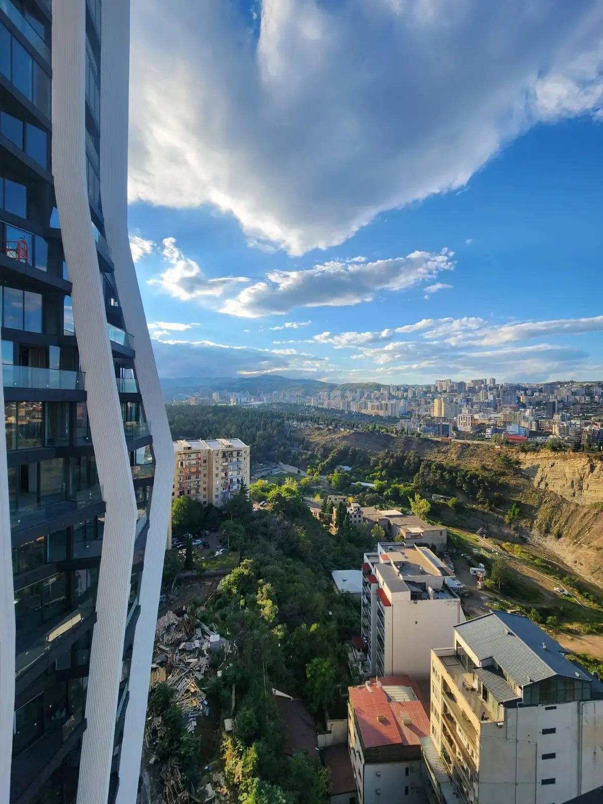 2-room apartment for sale on Tamarashvili Street, Vake, Tbilisi — city view from the terrace alongside the tower facade