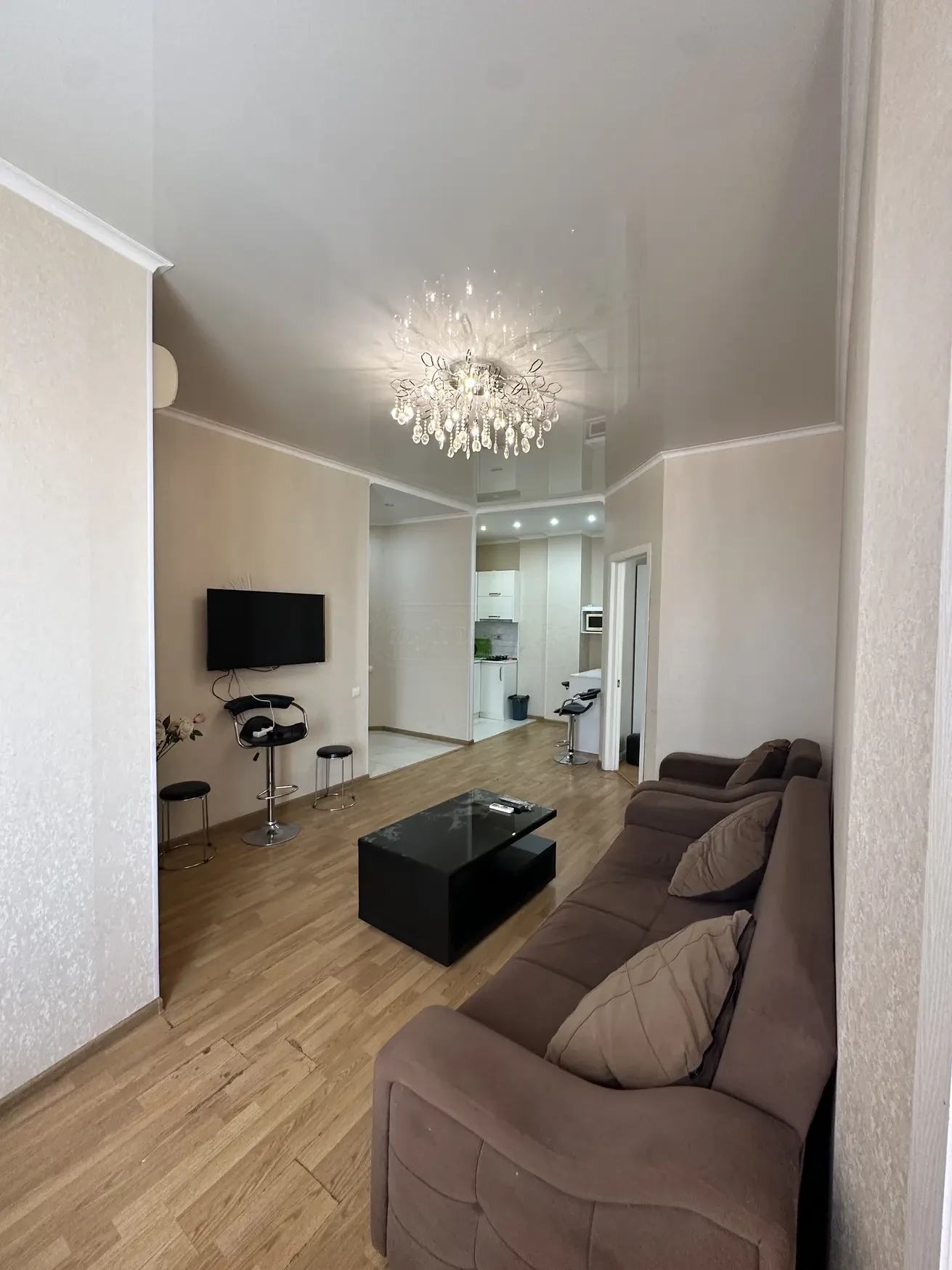 3-room apartment for rent on Shartava Street, Saburtalo, Tbilisi — living room opening onto the kitchen