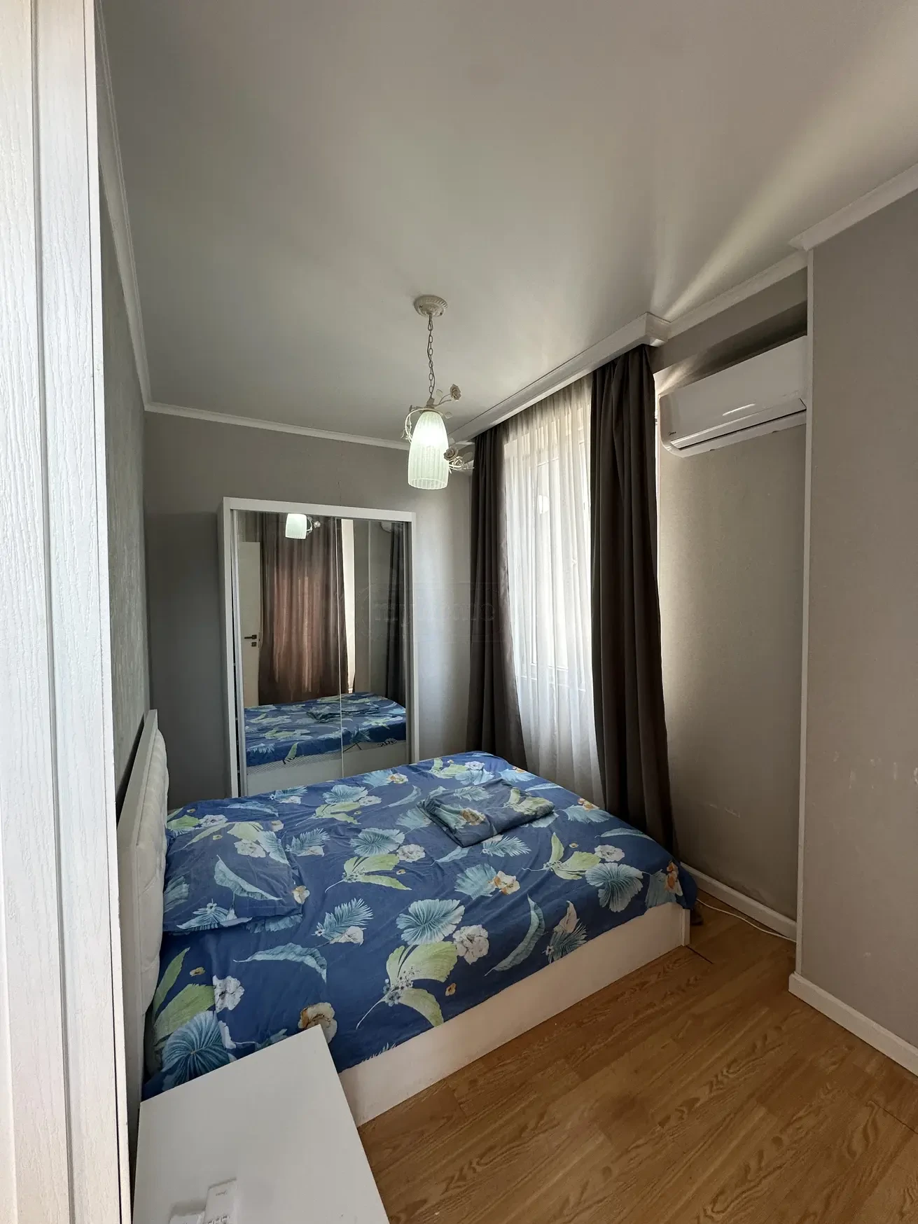 3-room apartment for rent on Shartava Street, Saburtalo, Tbilisi — second bedroom with mirrored wardrobe and air conditioning