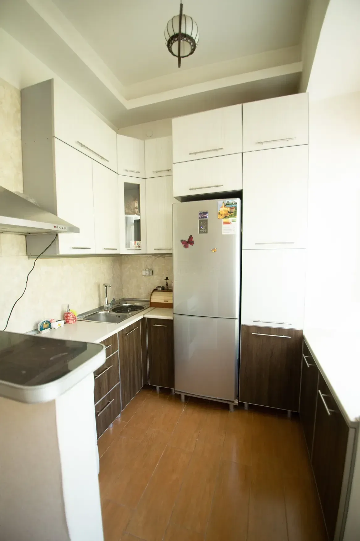 3-room apartment for rent on Tovstonogovi Street, Chugureti, Tbilisi — kitchen with fridge and cooker