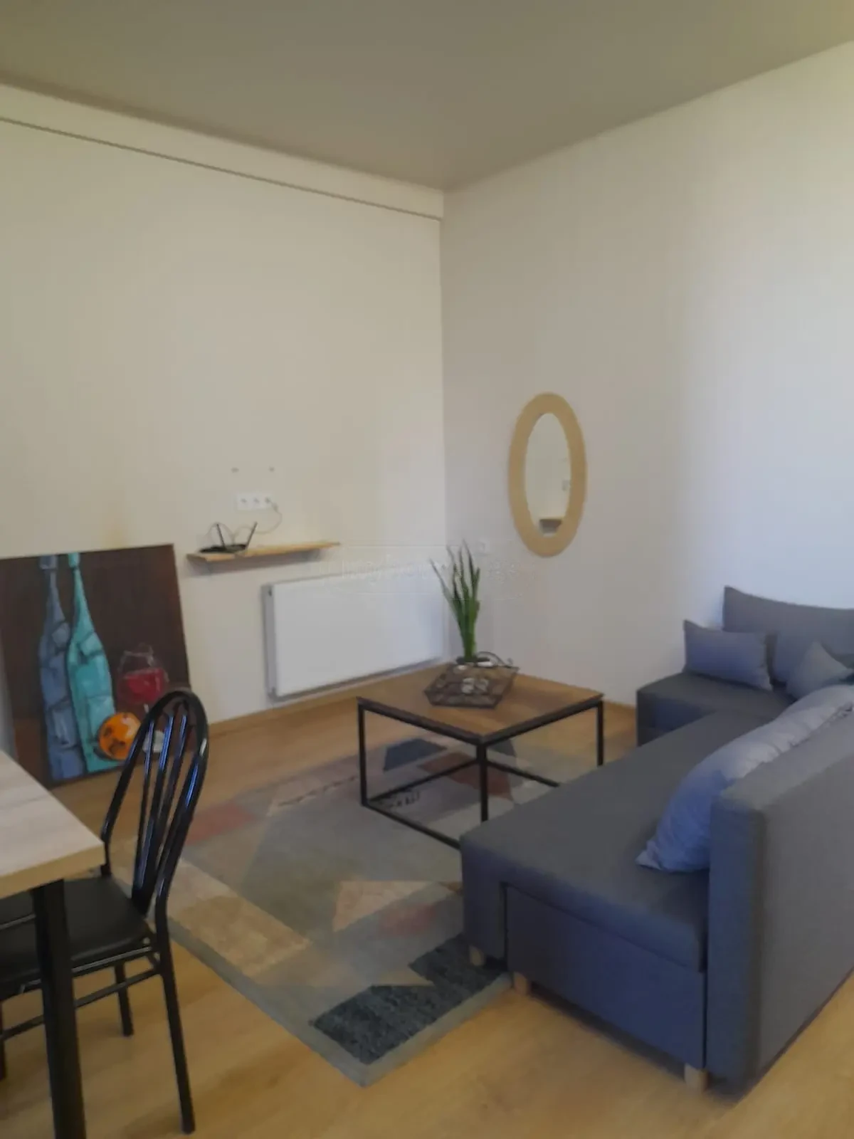 3-room apartment for rent on Tskneti Highway, Bagebi, Tbilisi — living room with sofa, coffee table and dining corner