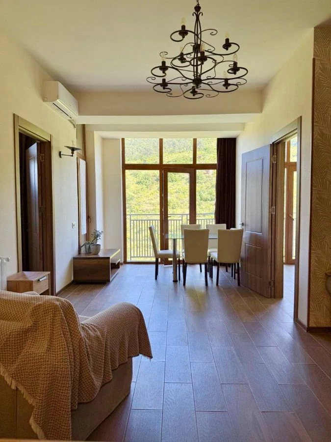 3-room apartment for sale on Chavchavadze Avenue, Vake, Tbilisi — living and dining room with panoramic doors to the balcony