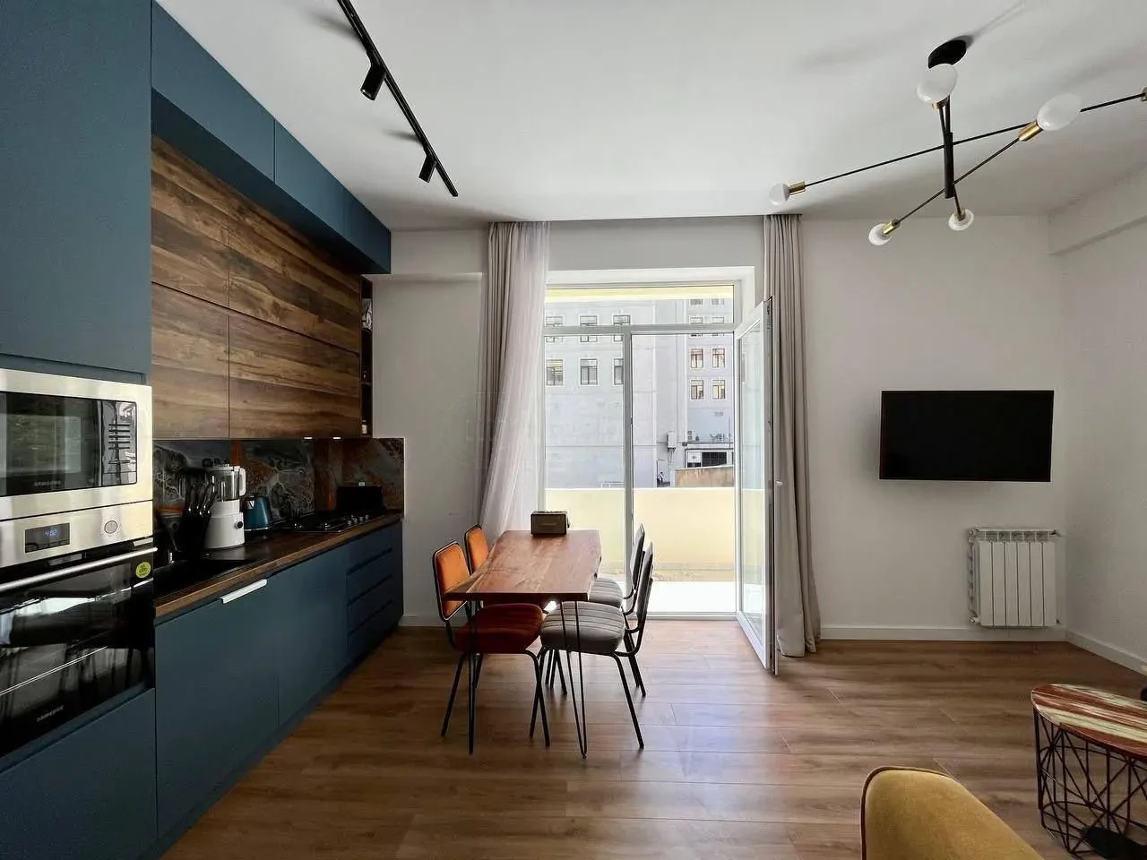 3-room apartment for sale on Chavchavadze Avenue, Vake, Tbilisi — kitchen and dining area with balcony access