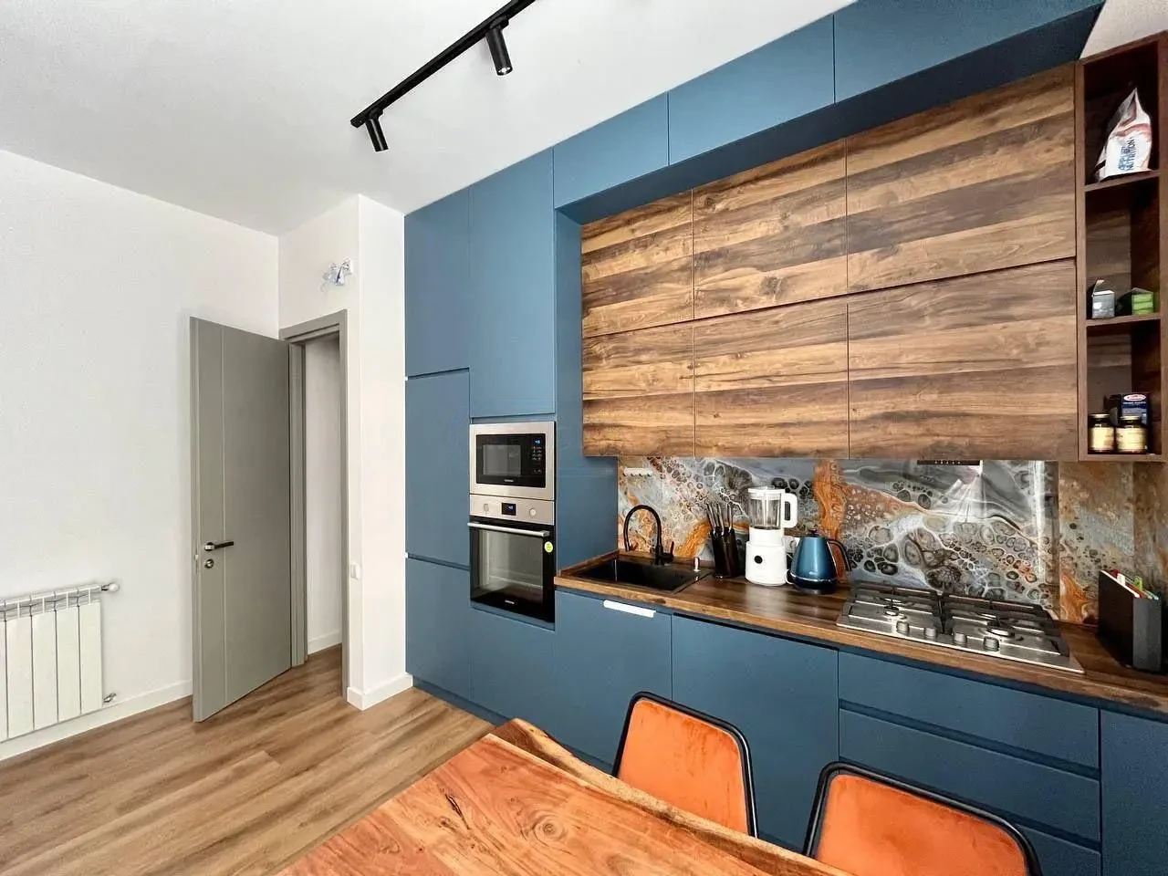3-room apartment for sale on Chavchavadze Avenue, Vake, Tbilisi — modern blue kitchen with wood accents