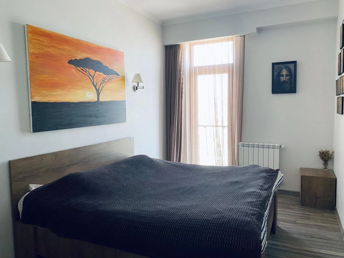 3-room apartment for sale on Marabda Street, Vake, Tbilisi — master bedroom with double bed and balcony door