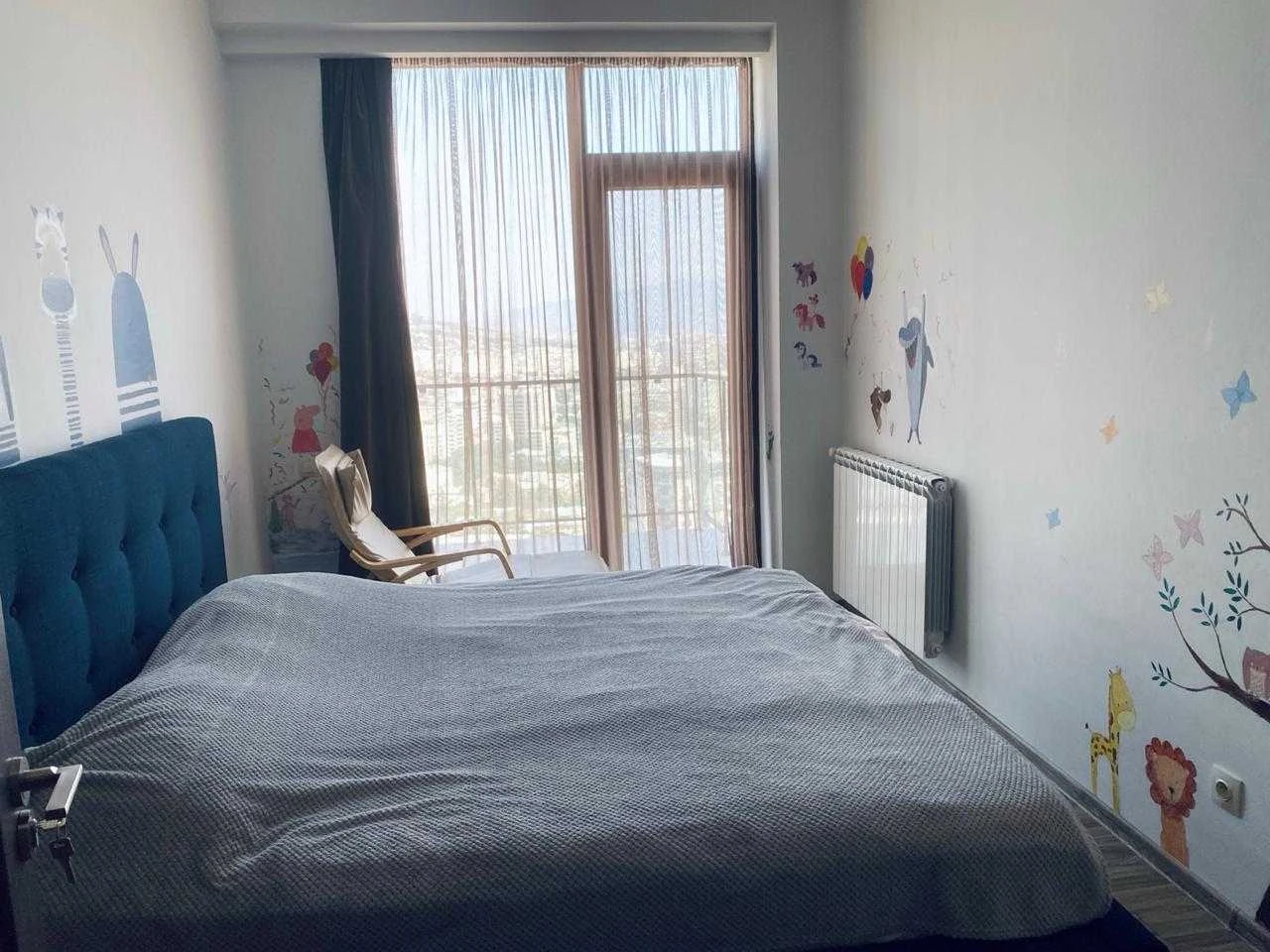 3-room apartment for sale on Marabda Street, Vake, Tbilisi — second bedroom with double bed and city-view balcony