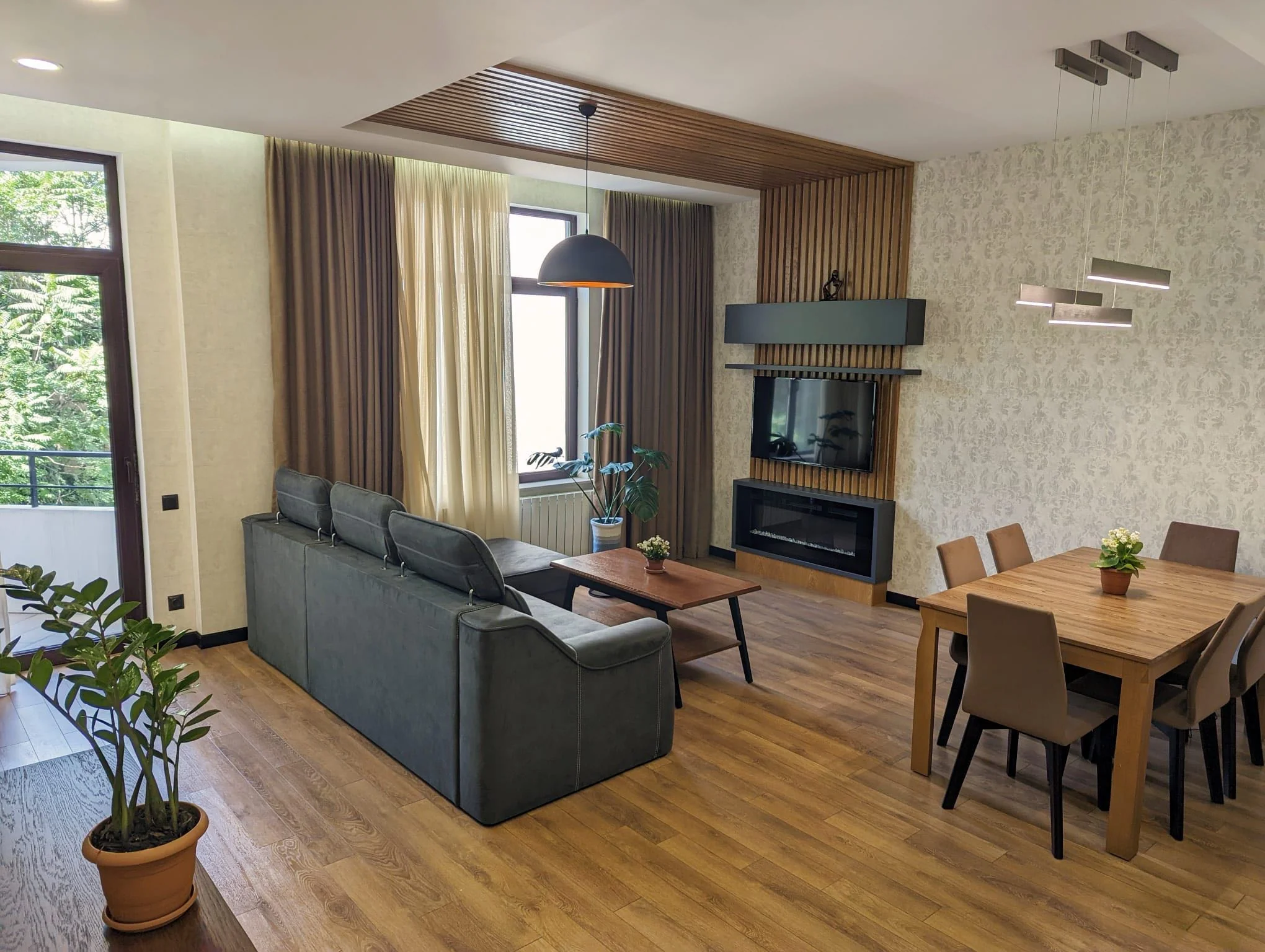 3-room apartment for sale on Mtskheta Street, Vake, Tbilisi — living room with balcony doors and garden view