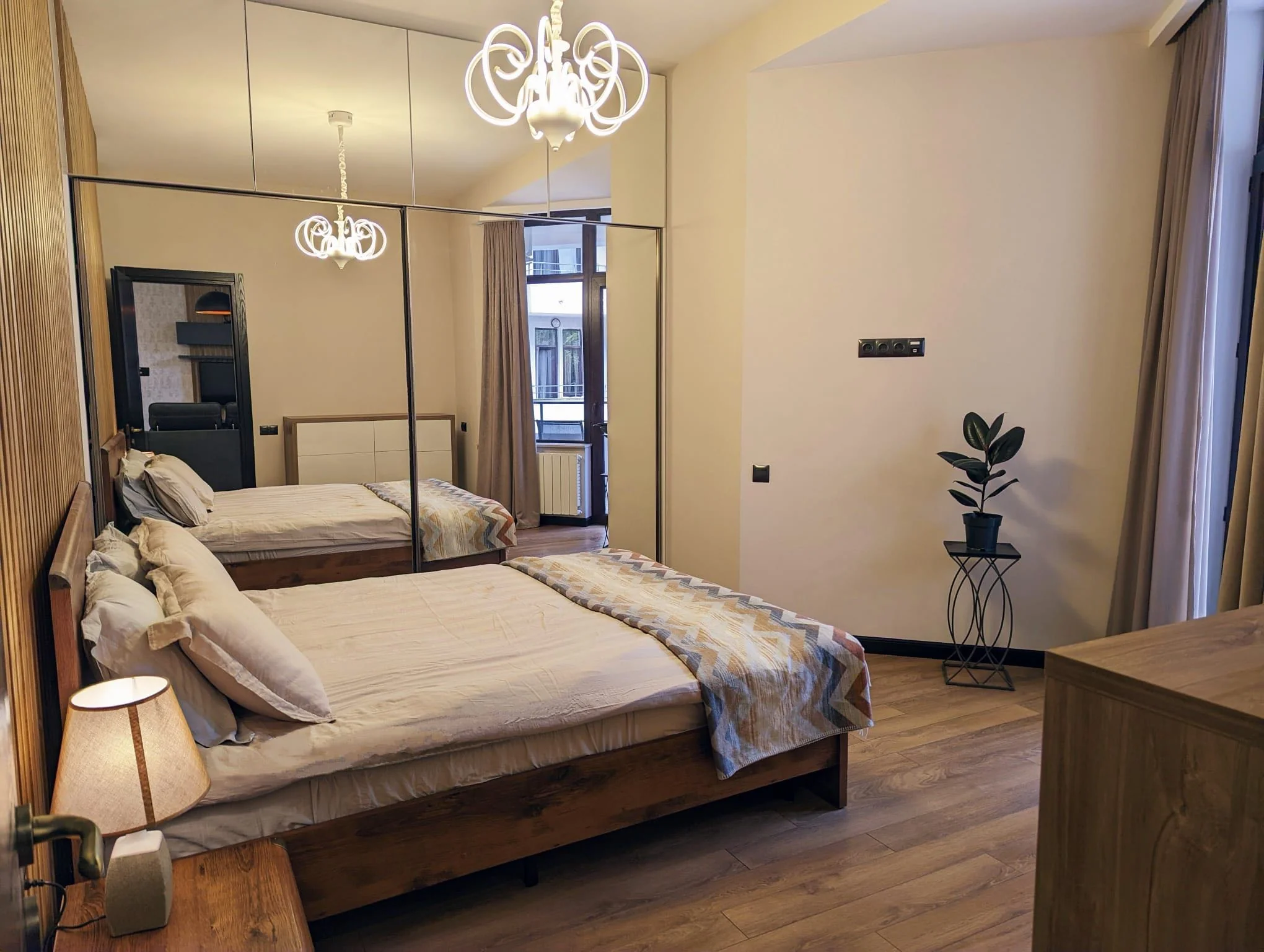 3-room apartment for sale on Mtskheta Street, Vake, Tbilisi — master bedroom with mirrored wardrobe