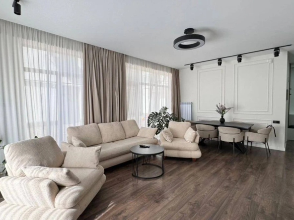 3-room apartment for sale on Nino Zhvania Street, Vake, Tbilisi — living room with dining area beyond
