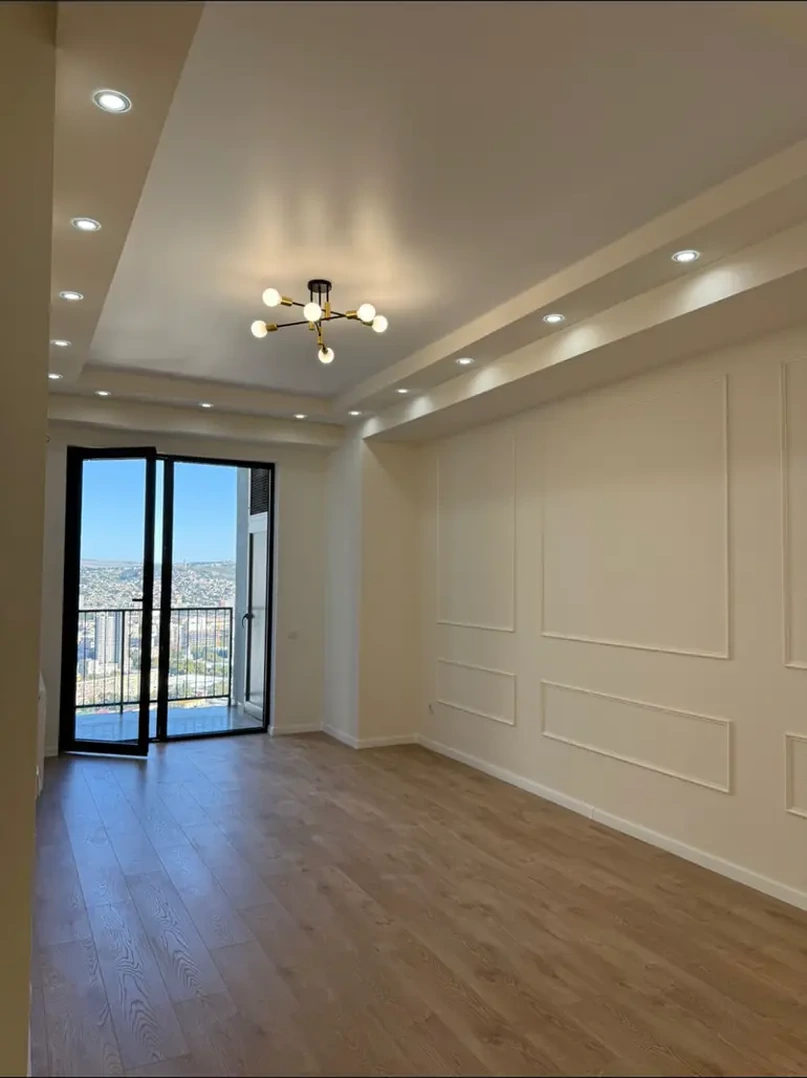 3-room apartment for sale on Shartava Street 43, Saburtalo, Tbilisi - living room with balcony access and panoramic city view