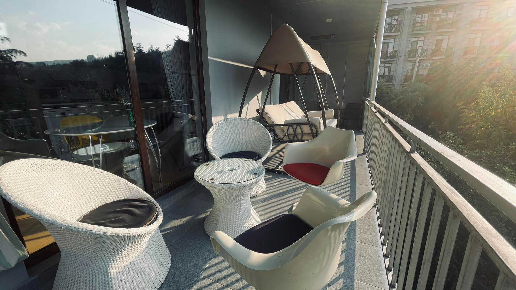 4-room apartment for rent on Titsian Tabidze Street 61, Vake, Tbilisi — sunny balcony with lounge chairs