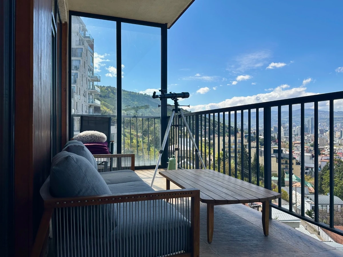 4-room apartment for sale on Marabda Street, Vake, Tbilisi — balcony seating area with a panoramic city view