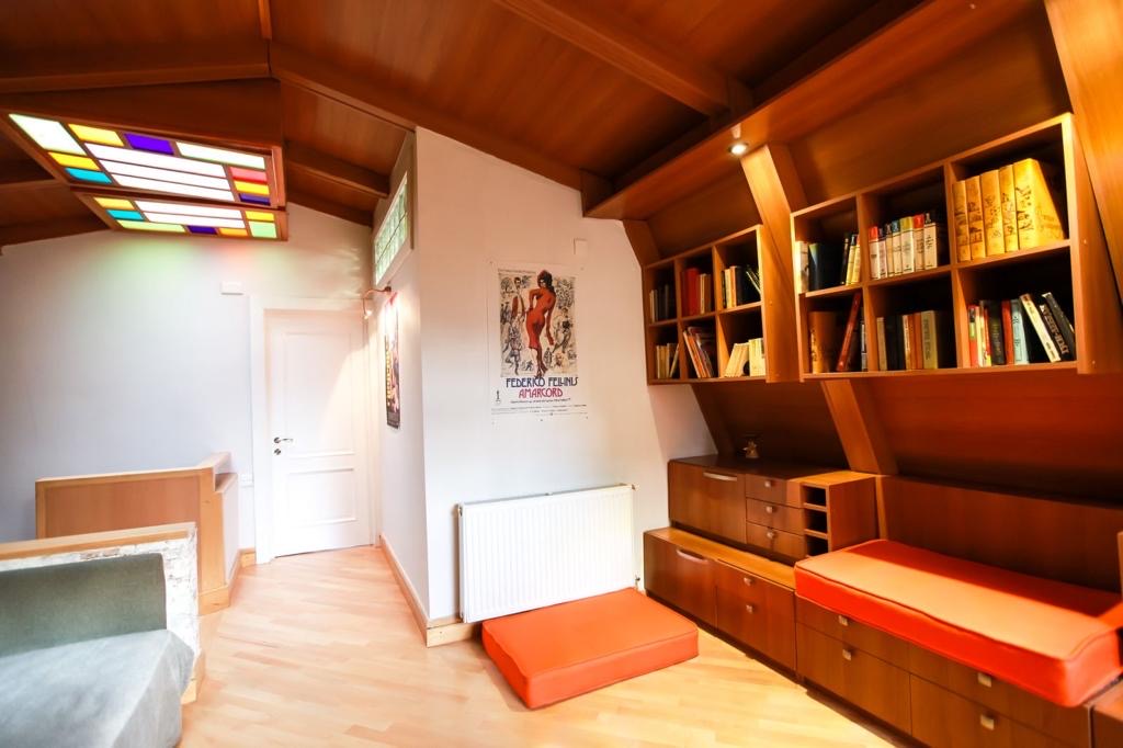 7-room house for sale on Marjanishvili Street, Chughureti, Tbilisi — library landing with stained-glass skylight