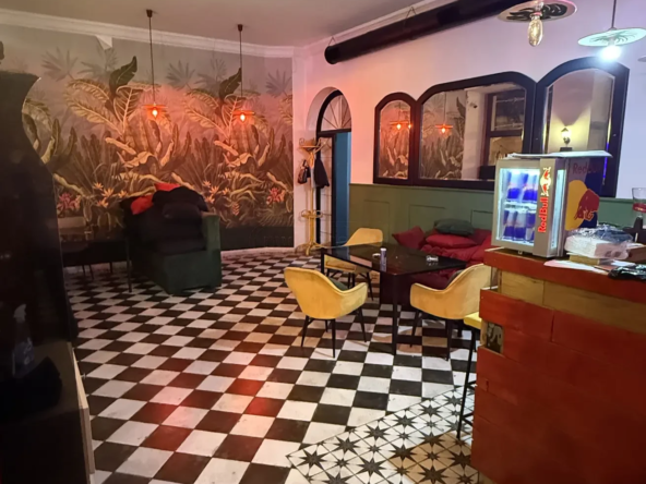 commercial cafe bar space for rent on Aghmashenebeli Avenue 26, Chugureti, Tbilisi — main lounge with checkered floor and jungle mural