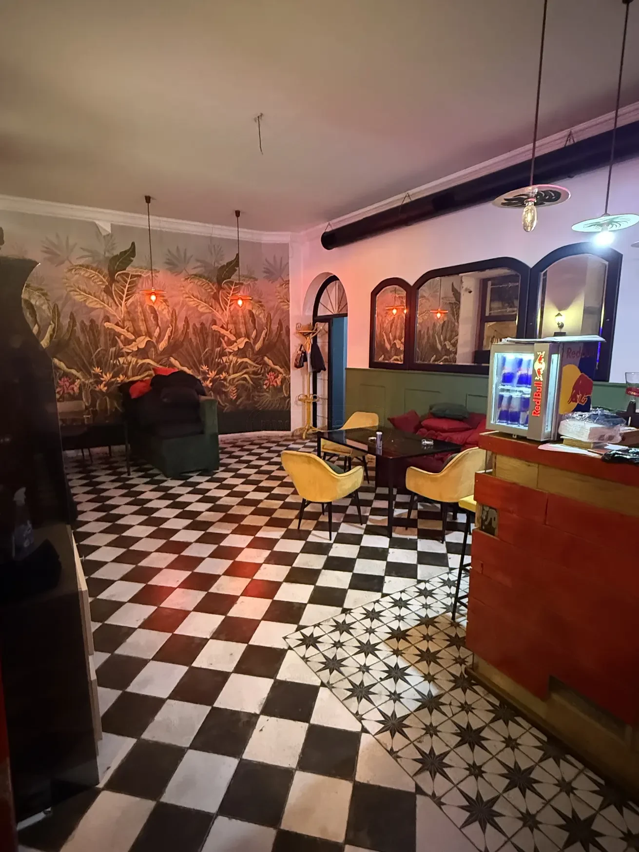commercial cafe bar space for rent on Aghmashenebeli Avenue 26, Chugureti, Tbilisi — main lounge with checkered floor and jungle mural