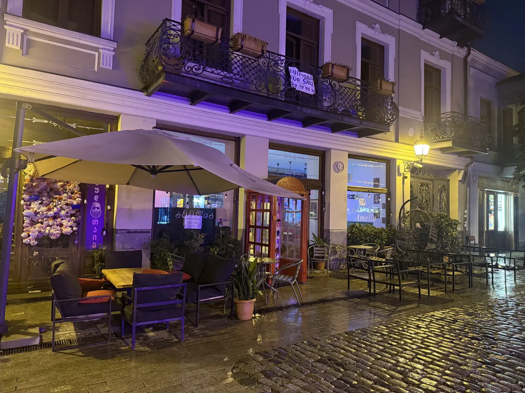 commercial cafe bar space for rent on Aghmashenebeli Avenue 26, Chugureti, Tbilisi — night facade with street terrace on the pedestrian avenue