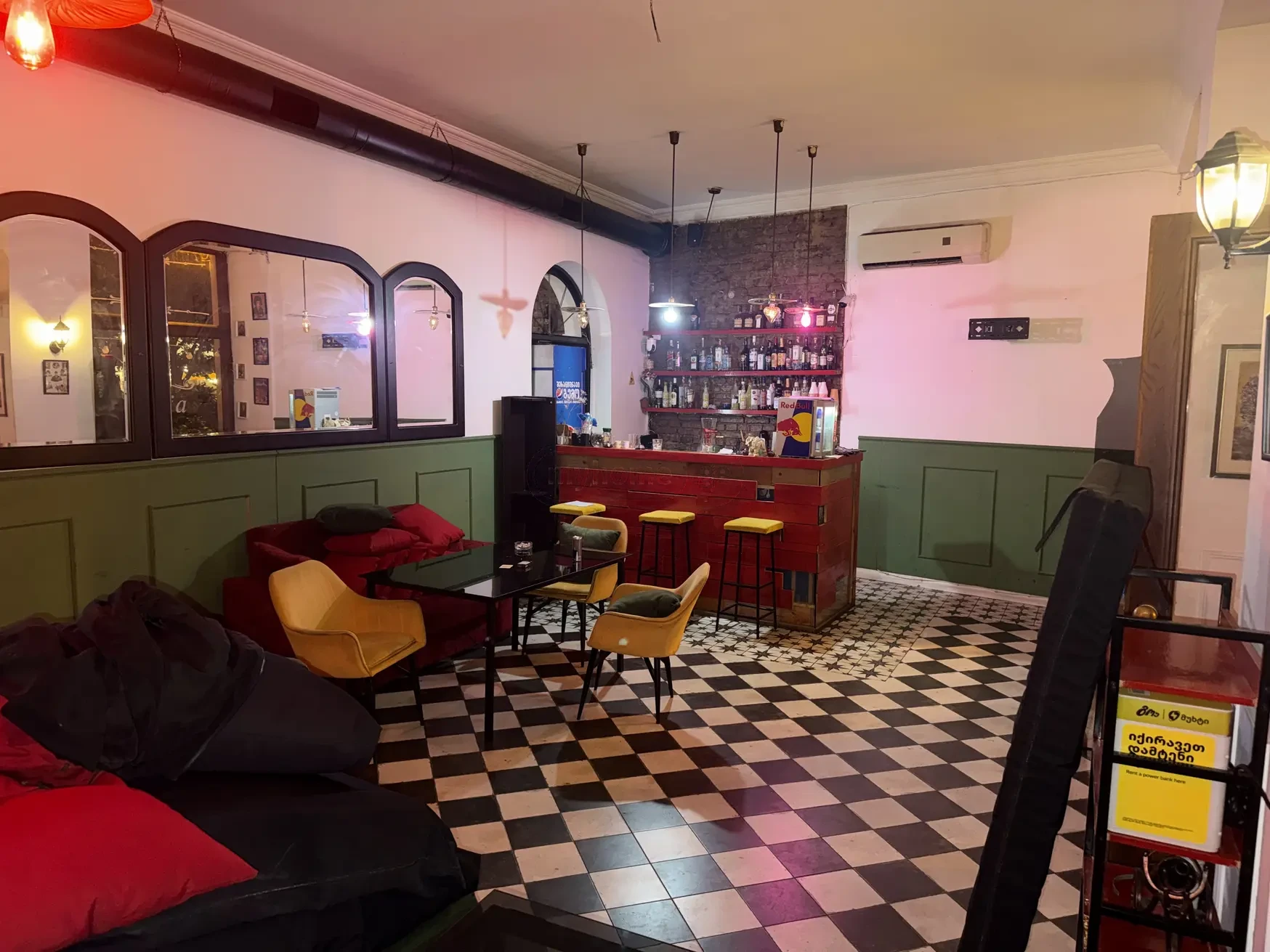 commercial cafe bar space for rent on Aghmashenebeli Avenue 26, Chugureti, Tbilisi — bar room with green wainscoting and cocktail shelves