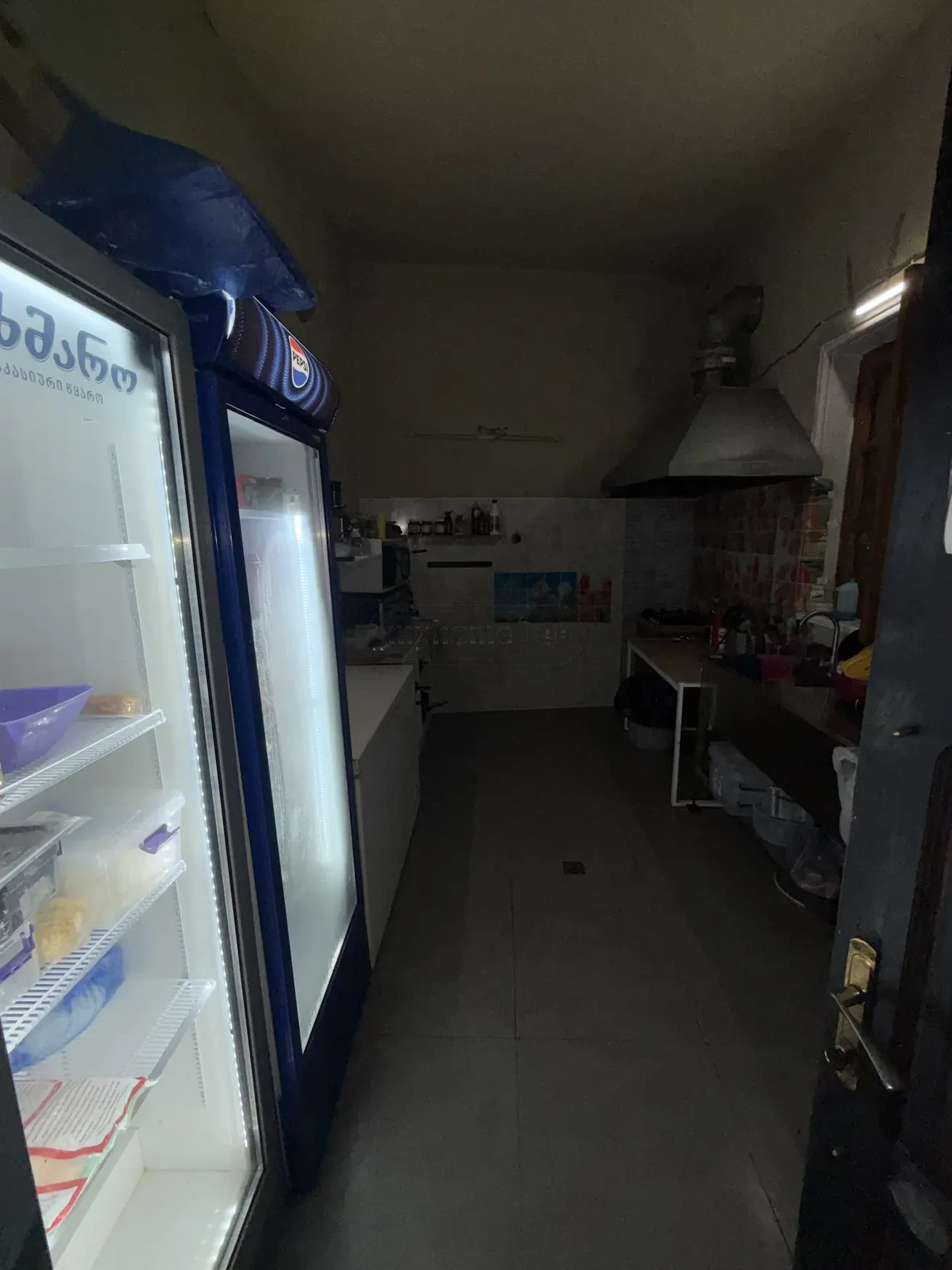 commercial cafe bar space for rent on Aghmashenebeli Avenue 26, Chugureti, Tbilisi — kitchen with extractor hood and display fridges